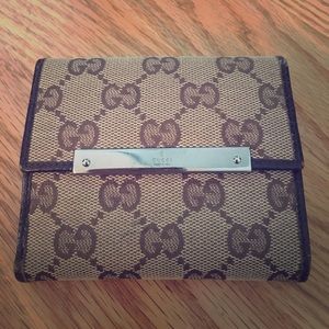 GUCCI WALLET monogram with Brown leather trim.